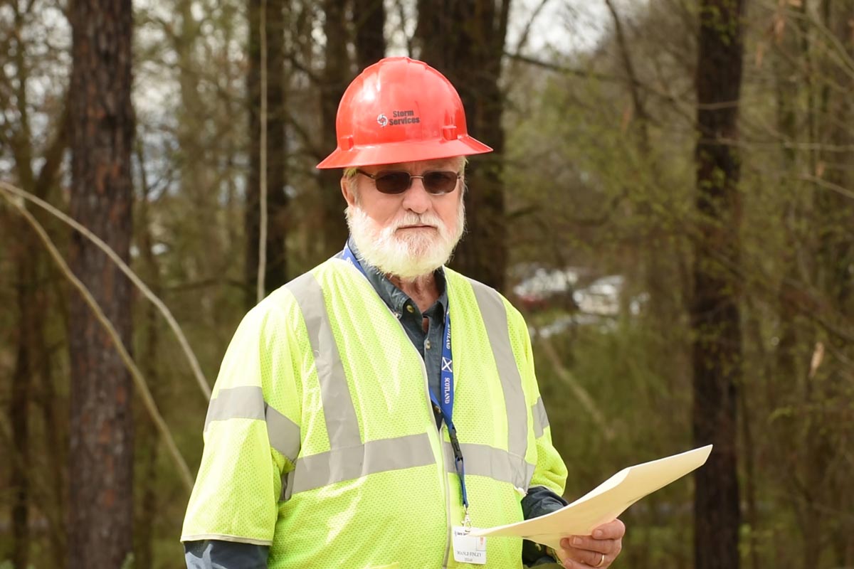 Damage assessor in the field.